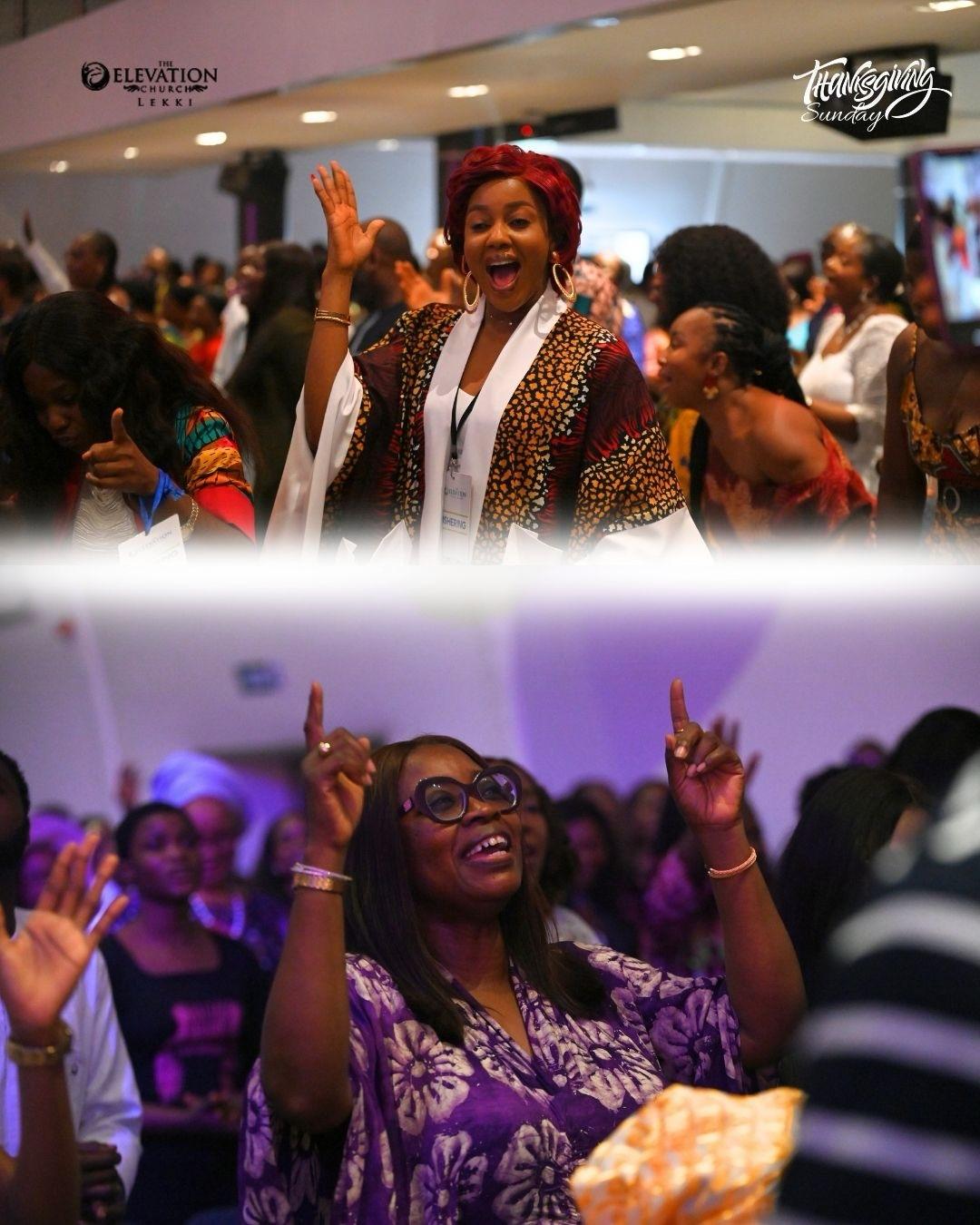 A worshipper at The Elevation Church raising her hands in praise